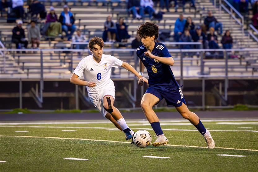 Students play soccer